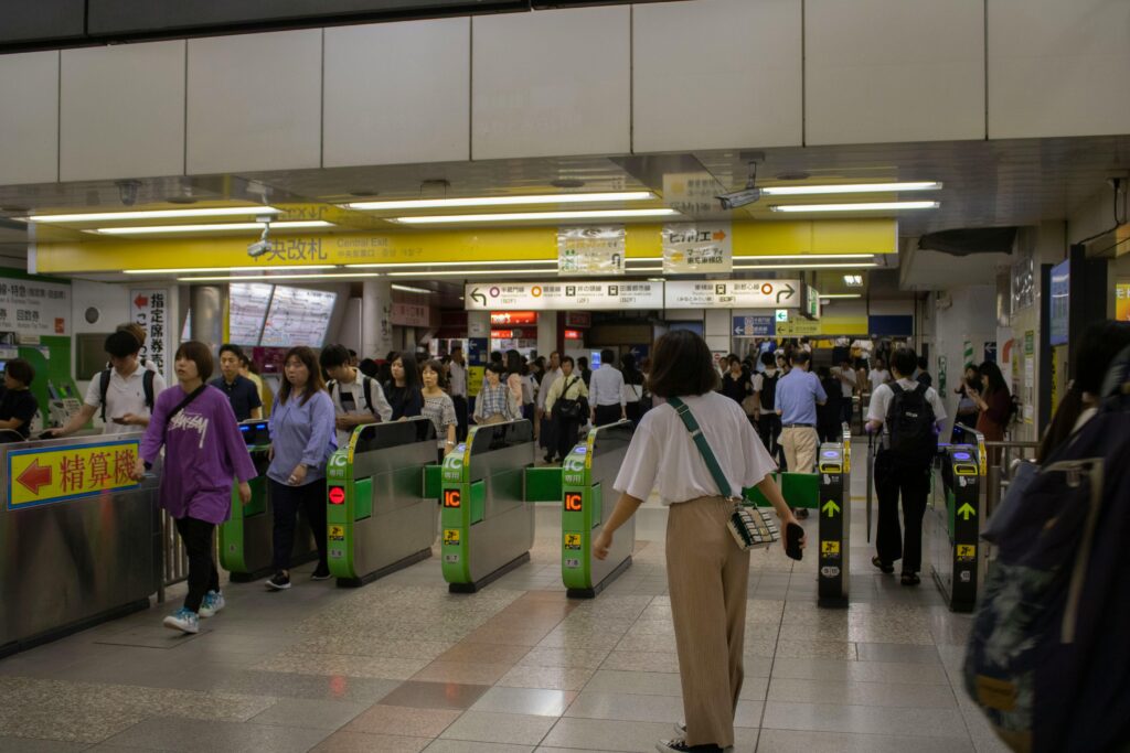 pexels photo 5905655 5905655 A crowded entrance of a Tokyo subway station with commuters passing through ticket gates.